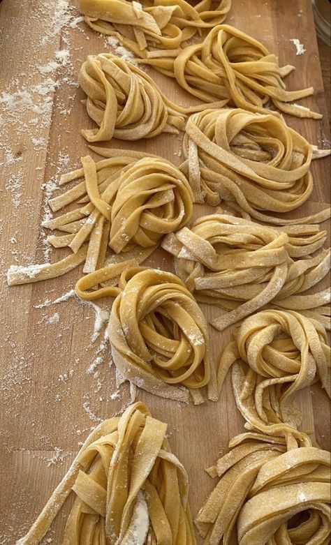Nests of fresh tagliatelle dusted with flour
