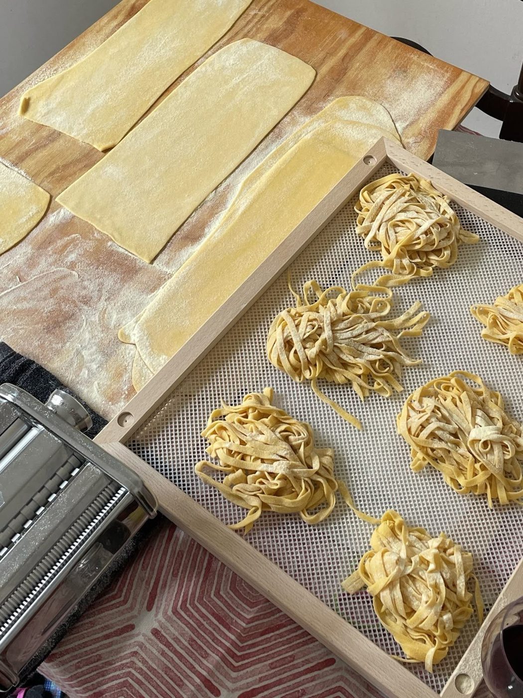 Freshly cut tagliatelle nests and rolled pasta sheets